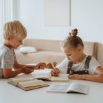 Homeschooled siblings working on project