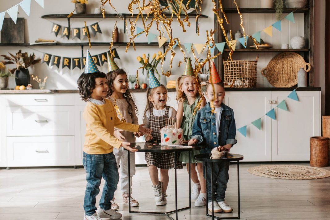 Kids wearing party hats having fun