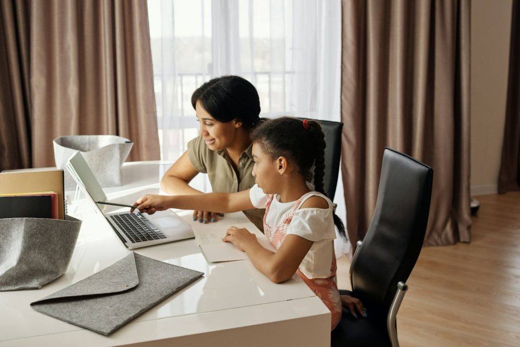 Mother Helping her Daughter with her Homework