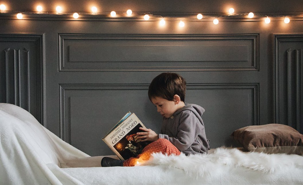 Little boy reading a book