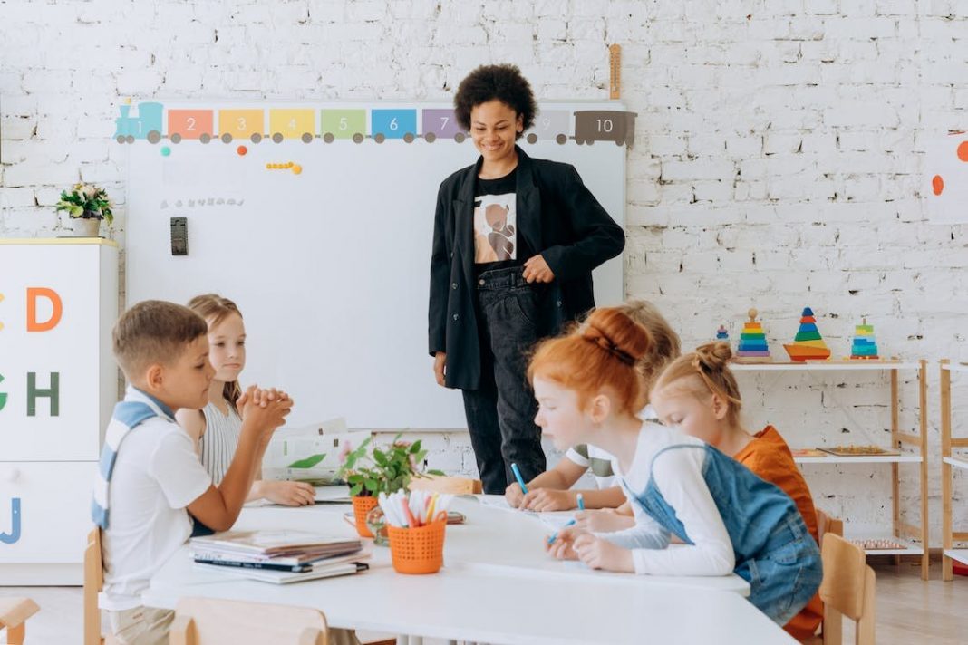 A group of children sitting around a table