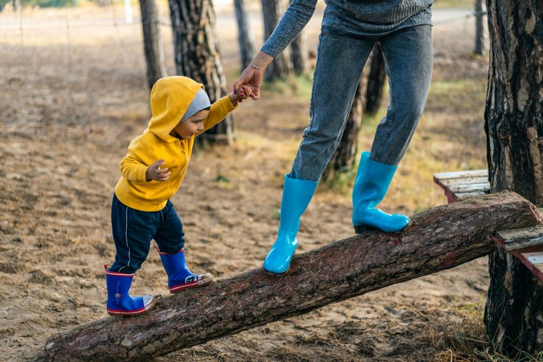 Toddler with mother in the park