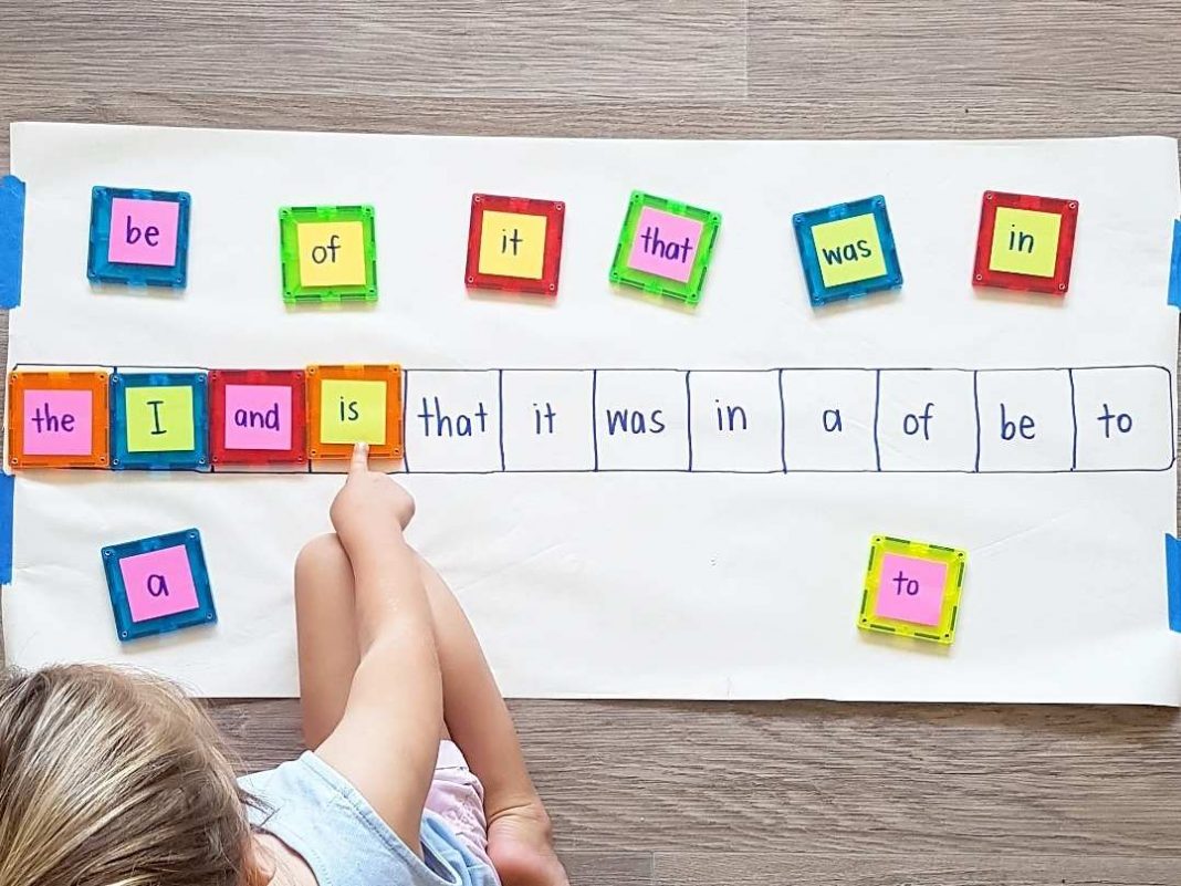 A kid learning sight words