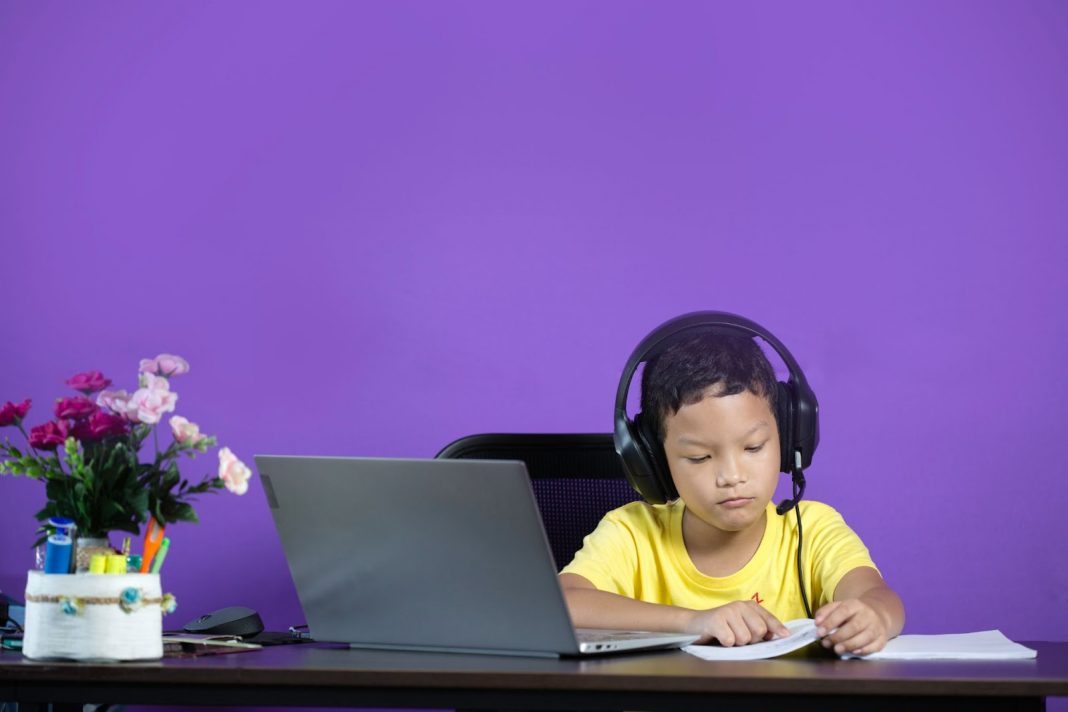 Kid studying using gadgets