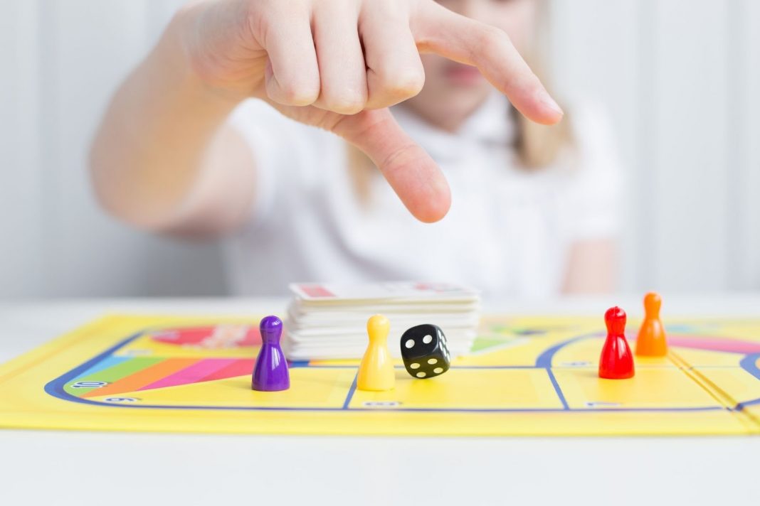 Kid playing dice game