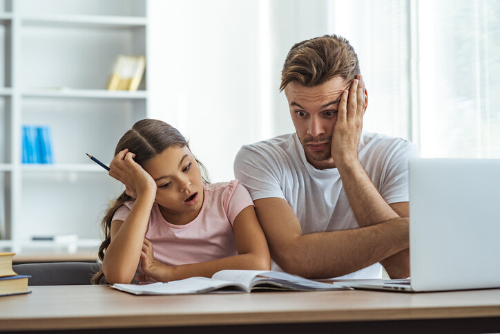 Father and daughter stressing over homeschooling