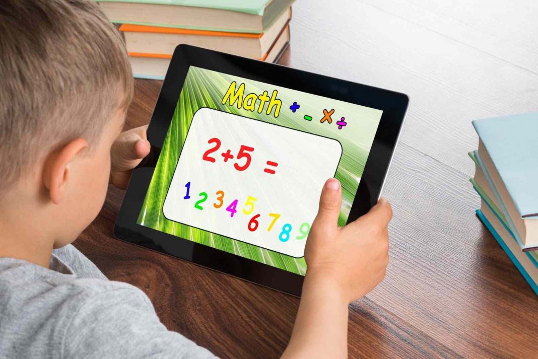 Kid using ipad for math