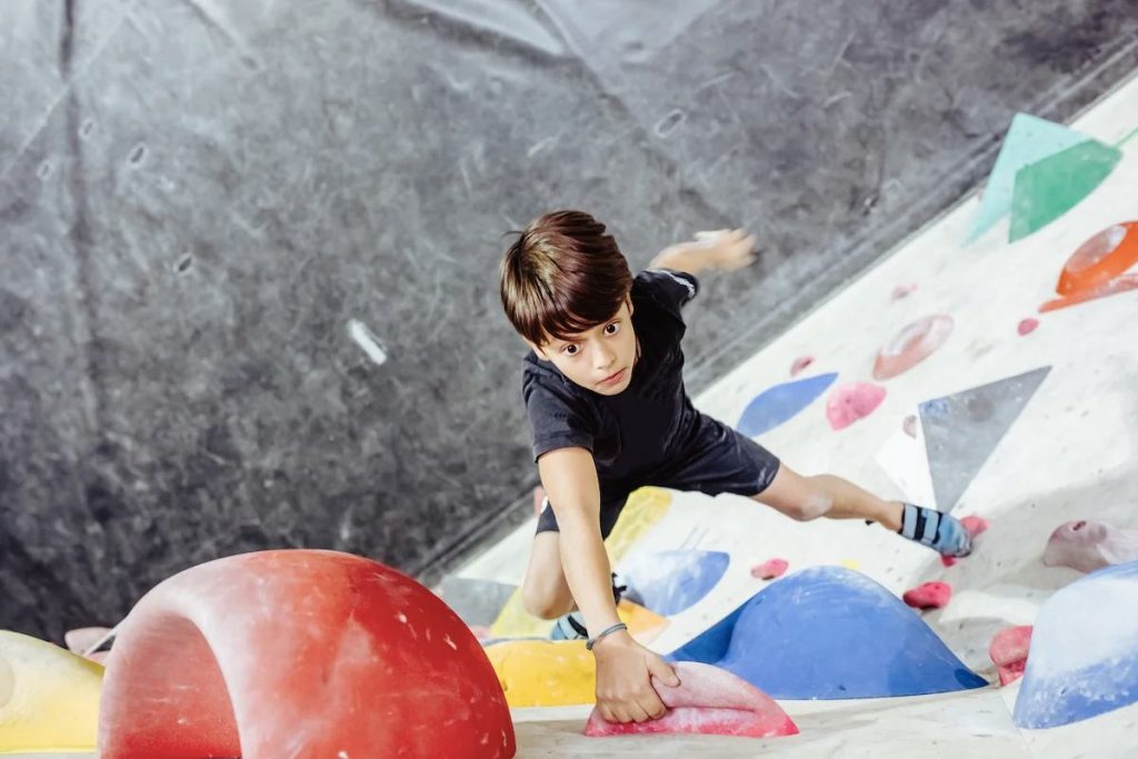 kid climbing rock