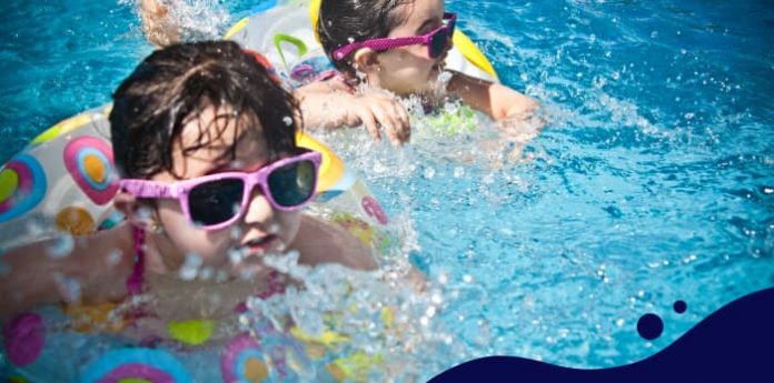 Image of kids enjoying in the pool in summer