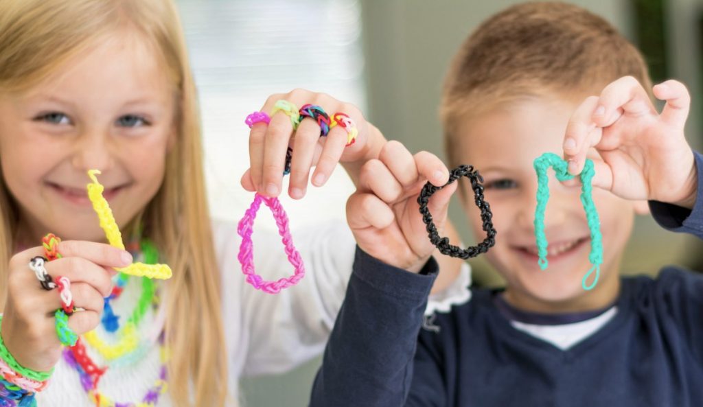 Kids holding bracelets