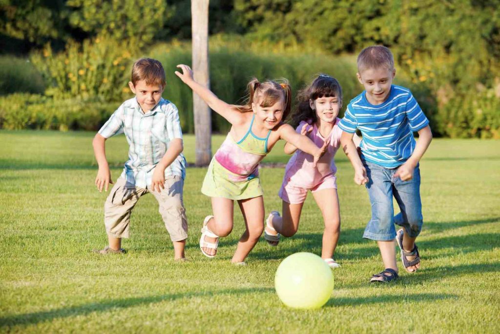 Kids playing kickball