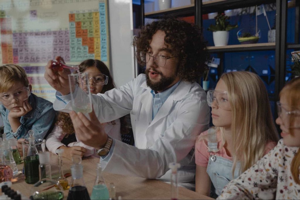 Image of a teacher in a science lab with students