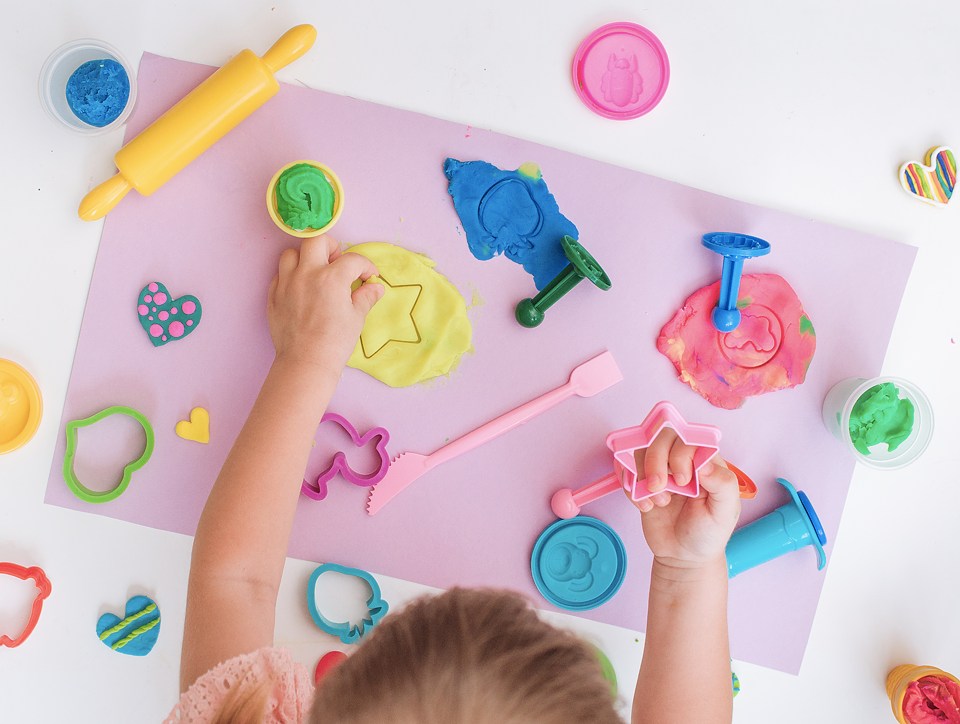 Kid using playdough