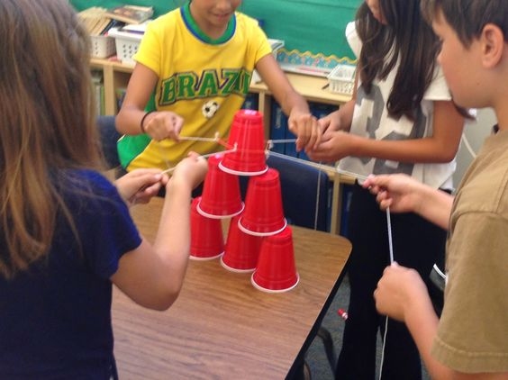 Kids playing group games indoors