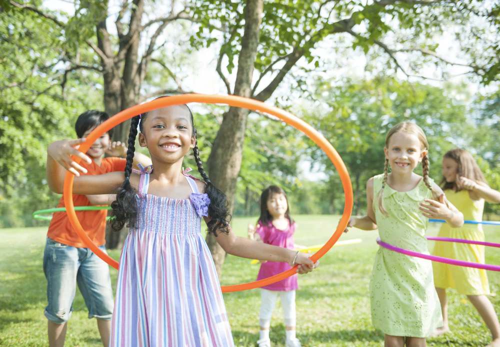 Kids doing hula hoop