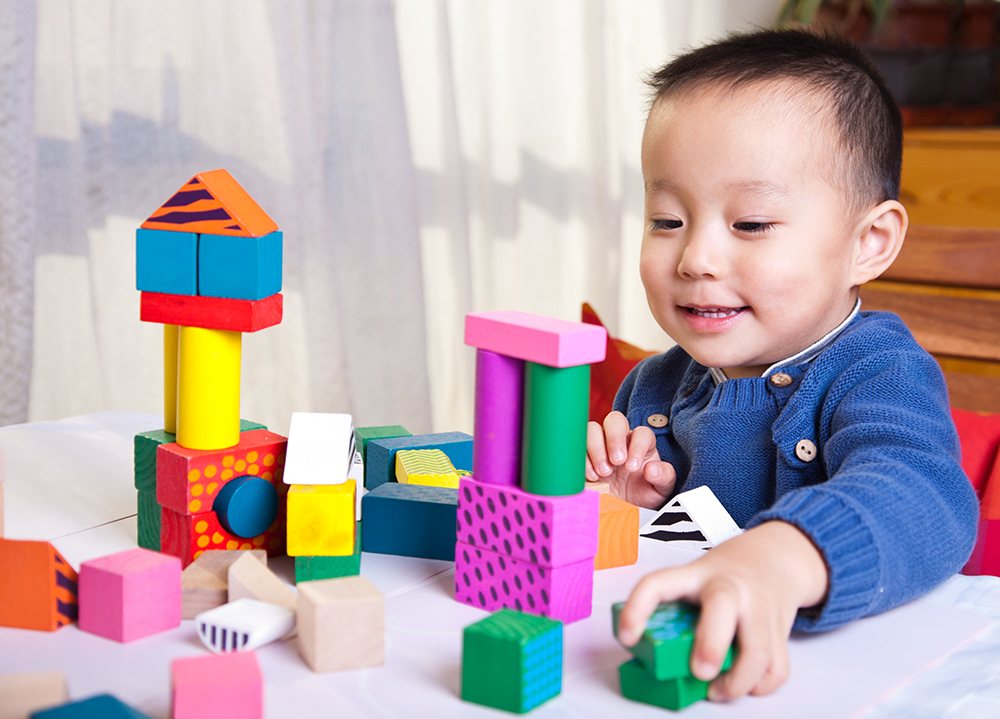 Child playing with building blocks