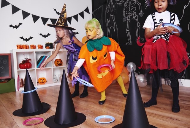 kids playing Witch Hat Ring Toss game