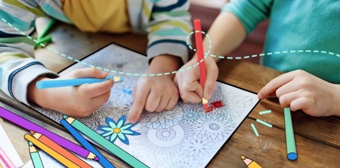 An image of kids using coloring pages