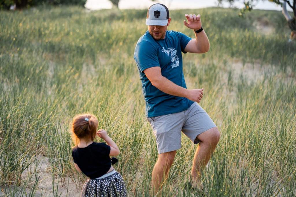 A child dancing with father